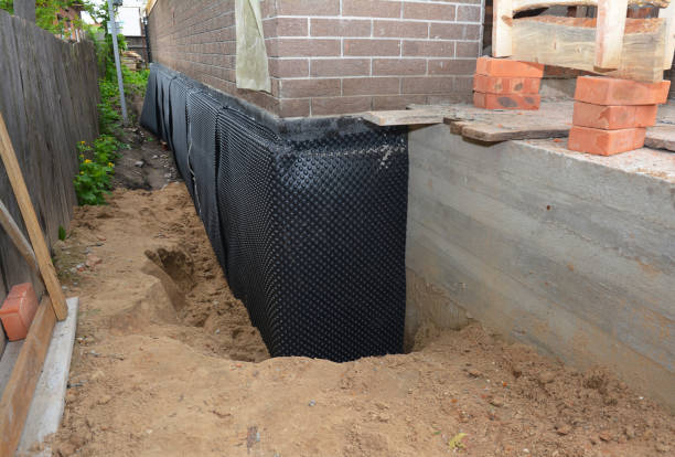 SJ Waterproofing Pros technician performing targeted Exterior Waterproofing assessment in New Baltimore, VA